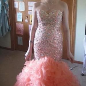 Mermaid style coral pink prom dress.